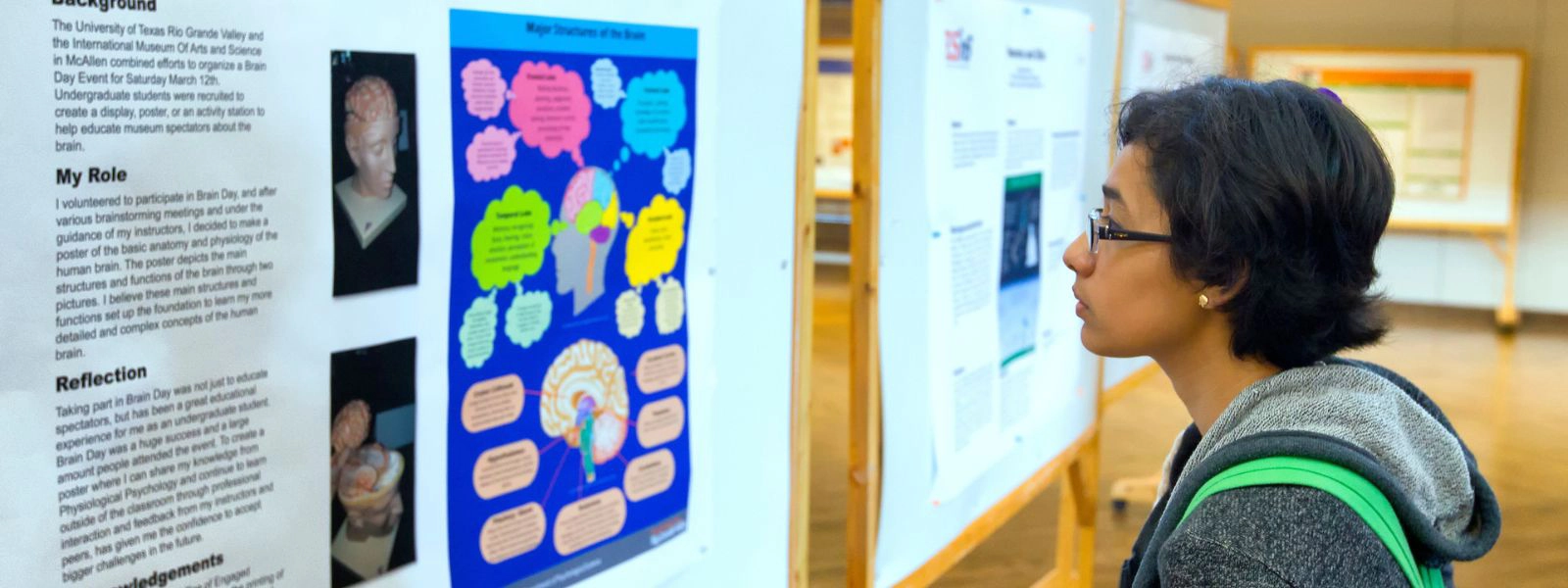 Student looks at a poster of the brain in Brownsville