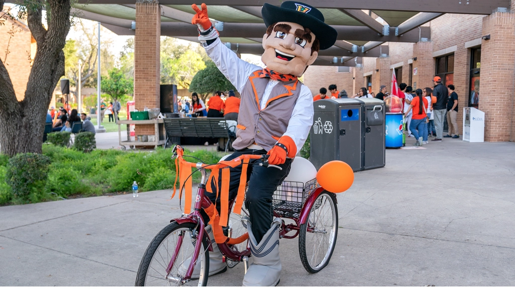 UTRGV mascot rides a bike on campus