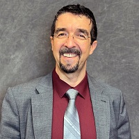 Smiling, faculty portrait of Dr. José Dávila-Montes