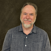 Smiling, faculty portrait.