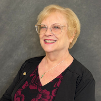 Smiling, faculty portrait.