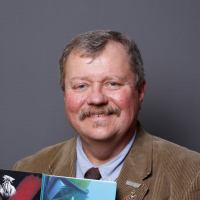 Smiling, faculty portrait.