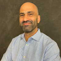 Smiling, faculty portrait.