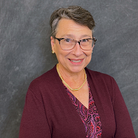 Smiling, faculty portrait.
