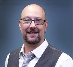 Smiling, faculty portrait.