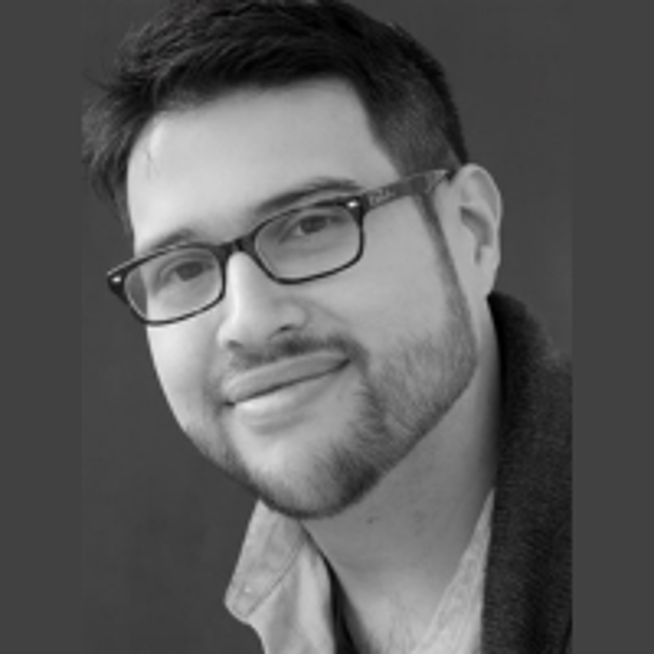 Smiling, faculty portrait.