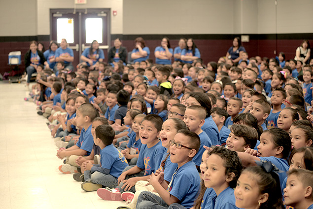 Children at the theatre play the giants