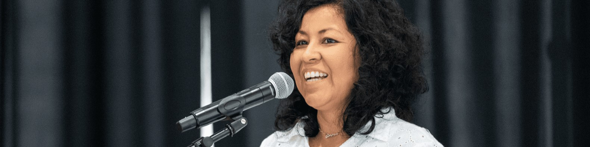 Emmy Perez speaking onstage.