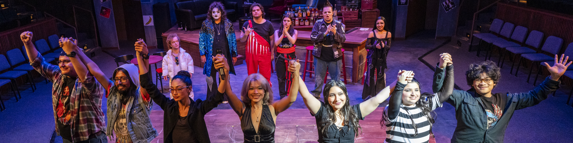 Theatre students pose after a performance