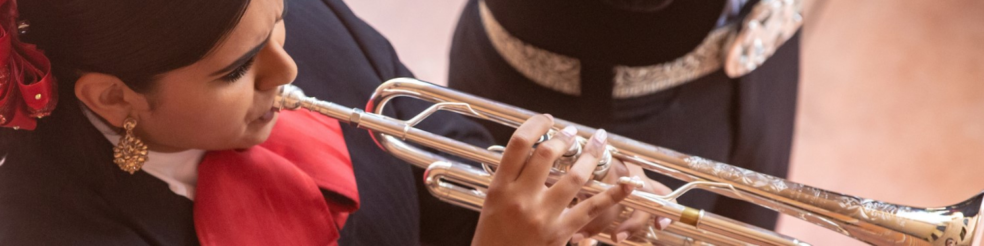 Mariachi student plays during a staff senate event