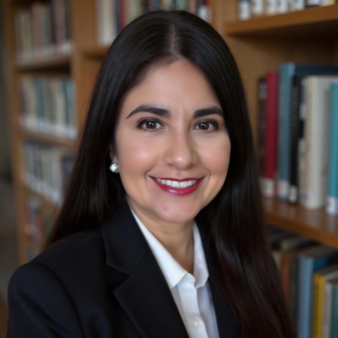 Dr. Paz smiling at camera