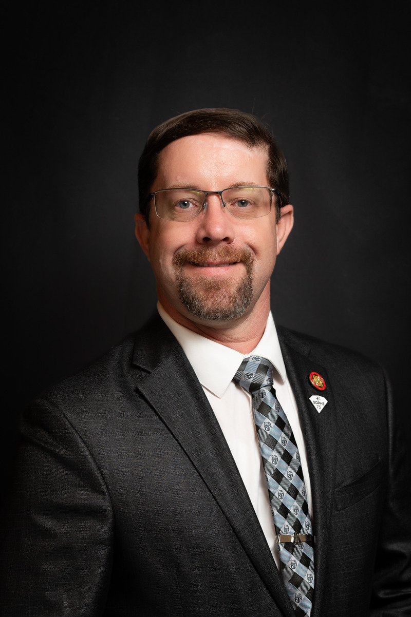 Photo of associate dean smiling at camera.