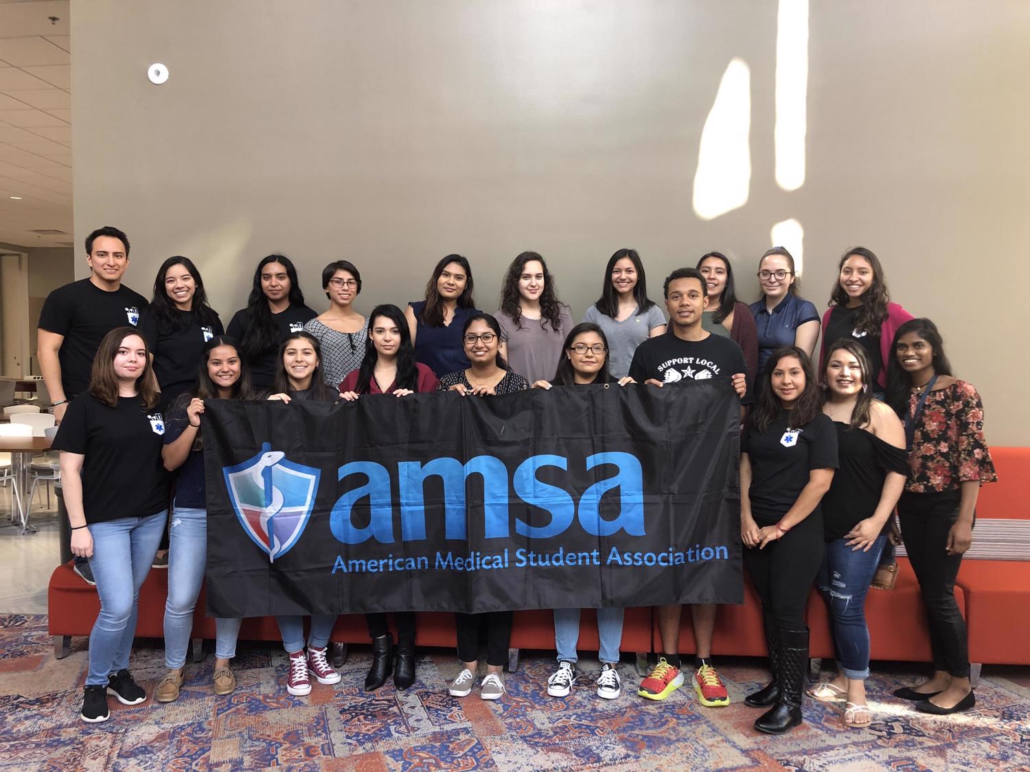 american medical association group picture holding up amsa banner