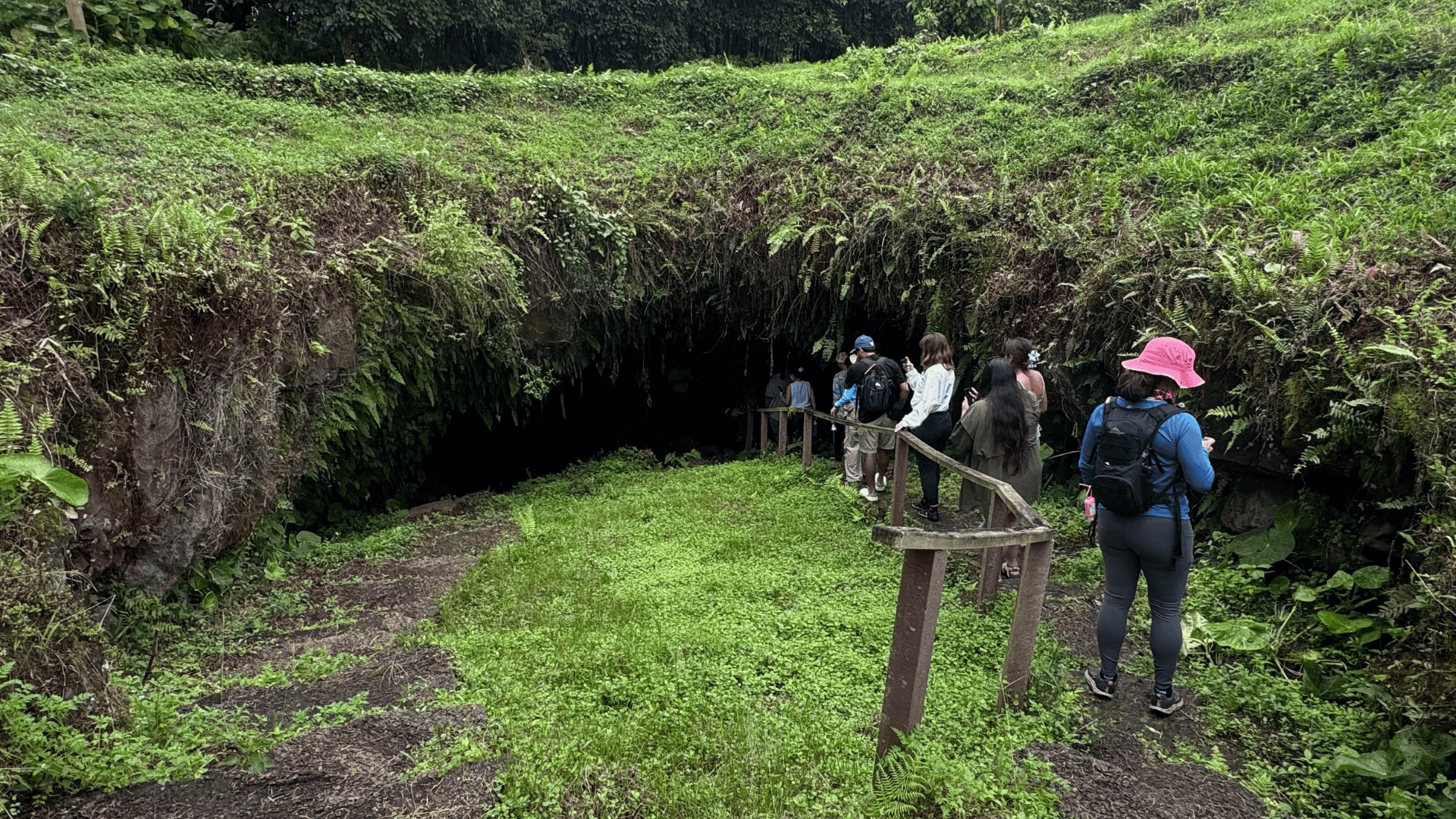 UTRGV students heading into the entrance of a cave at Galapagos Islands