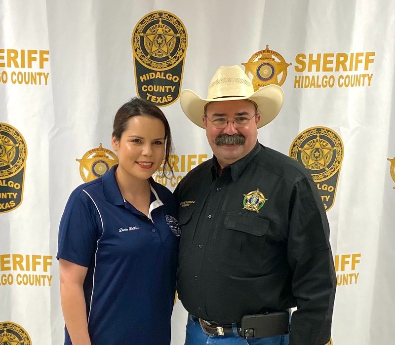 Club member next to Sheriff posing for a picture