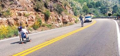 Skateboarders on the road.