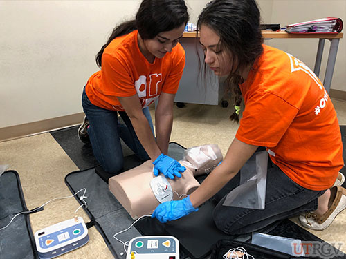 Working together to perform CPR while getting the AED ready, November 30, 2018.