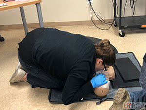 Giving rescue breaths on an adult manikin, November 28, 2018.