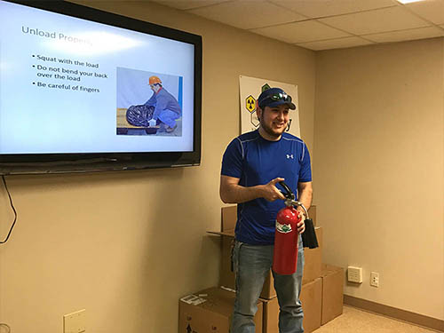 During this Back Safety Training conducted by Laura De Jesus, the employee was given a fire extinguisher to model proper posture while lifting.