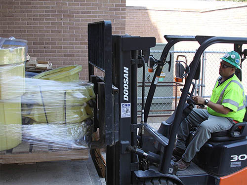 Robert Gilchrist demonstrates how to safely move a loaded pallet during Forklift / Lift Truck Operator Safety Training.