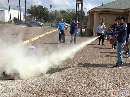 Practicing with a Fire Extinguisher during Evacuation Assistant/Fire Extinguisher Training, February 26, 2019.