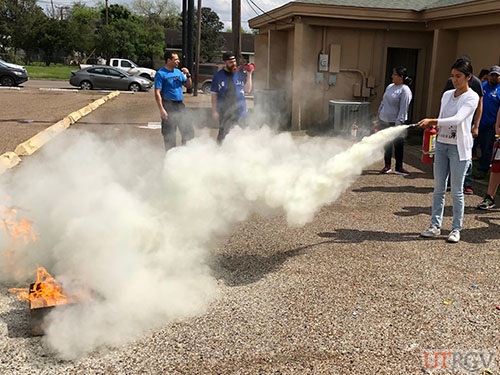 Practicing with a Fire Extinguisher during Evacuation Assistant/Fire Extinguisher Training, February 26, 2019.