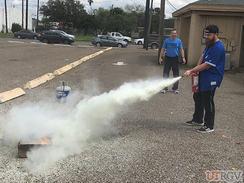 Practicing with a Fire Extinguisher during Evacuation Assistant/Fire Extinguisher Training, February 26, 2019.