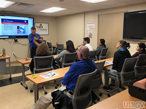 Instructor demonstrating tourniquet use, Stop the Bleed Training, December 2018