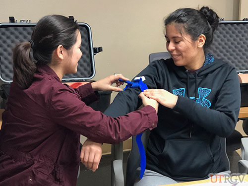 UTRGV students practicing with tourniquet, Stop the Bleed Training, December 2018
