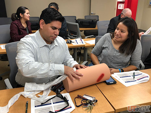 Practicing wound packing, Stop the Bleed Training, December 2018
