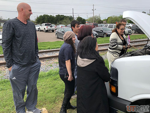 Looking under the hood during 12 and 15-Passenger Van Training.