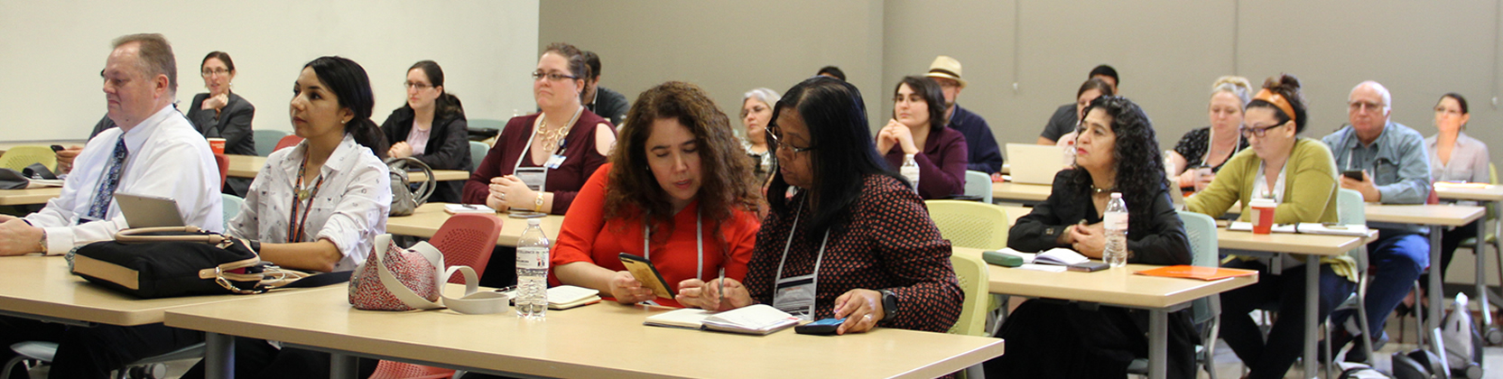 Conference attendees listening to a presentation