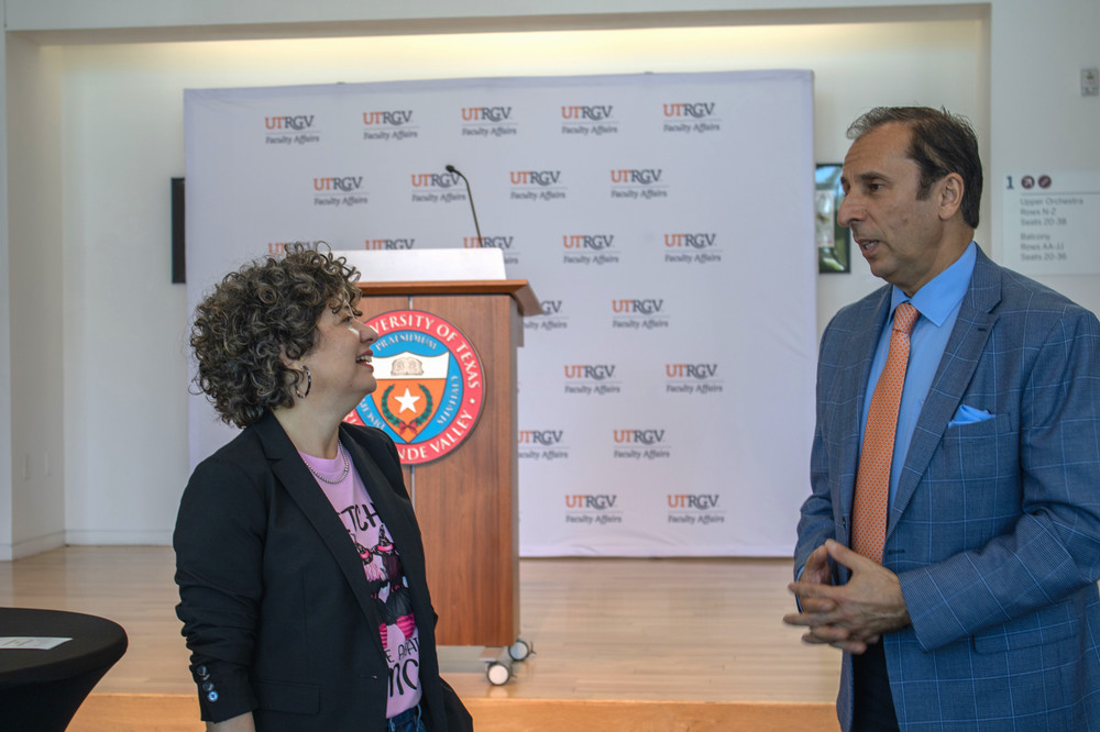 dr saavedra and dr saygin having a discussion during the 14 day writing challenge kick off party