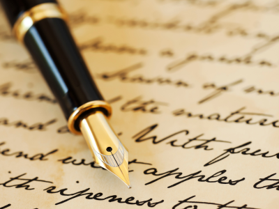Pen with writing on paper
