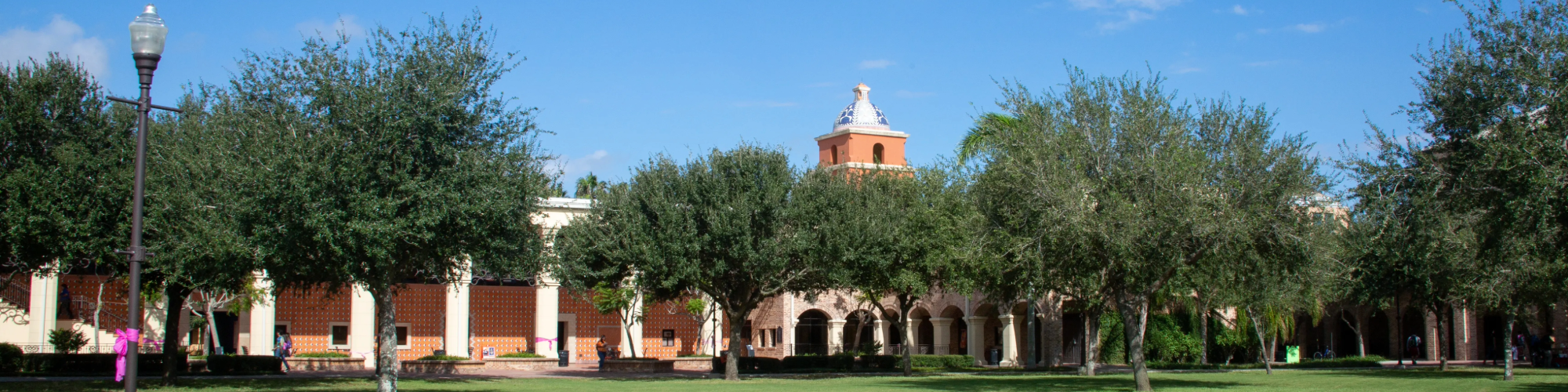 Campus building with empty field.