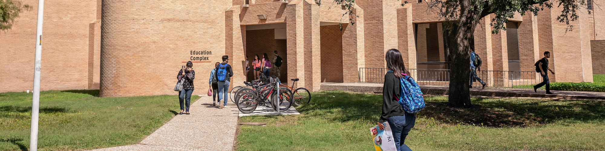 Students walking into a campus building.