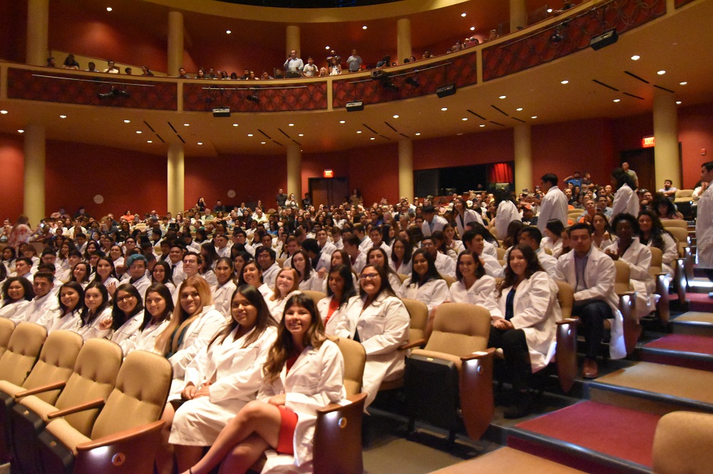 BMED White coat ceremony students seated at performing arts center