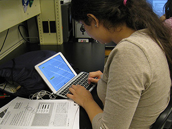 Important Dates - a High Scholars student working on a computer