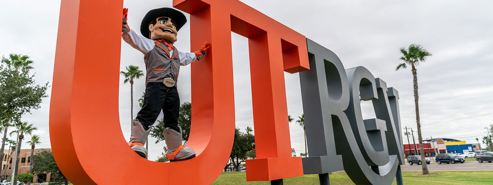 UTRGV mascot on UTRGV sign