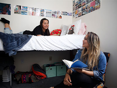 two students talking to each other