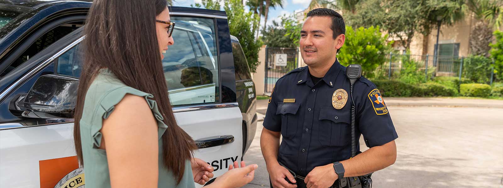 campus police speaking with student