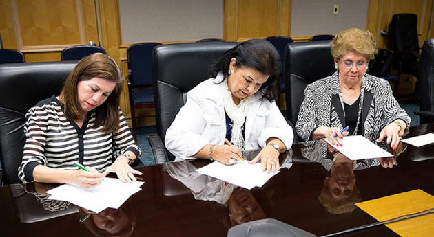 Rosie Longoria, Linda Garza and Maria Bertha Martinez sign endowment agreements creating three McAllen Child Study endowments.