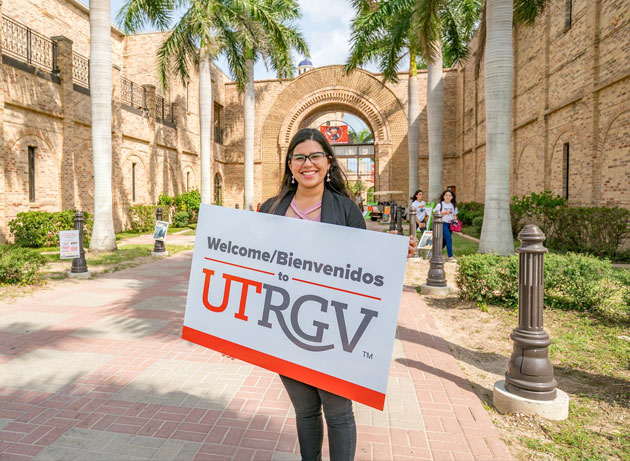 UTRGV student holding sign Welcome to UTRGV