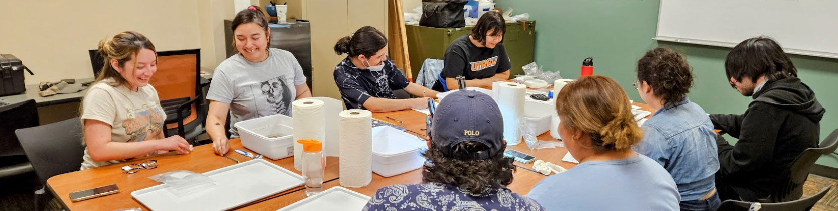 Students learning to process artifacts in the Laboratory of Valley Archaeology. Page Banner 