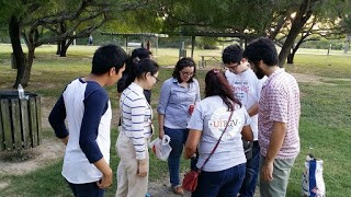 Associate Professor, Mao enjoys the evening breeze with his group members 