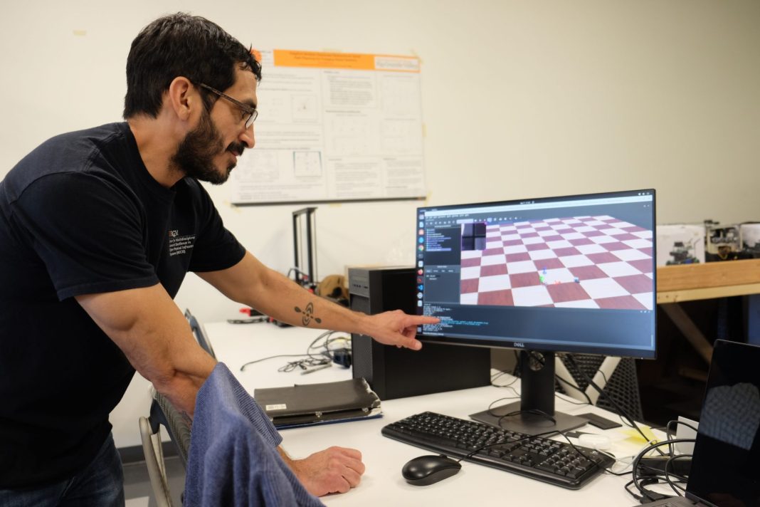 Eric Rodriguez, a UTRGV researcher, shows a deeper enforcement learning program to train AI on drones by putting into a simulation over and over again on Monday, April 7, 2025, in Edinburg. (Omar Zapata | The Monitor)