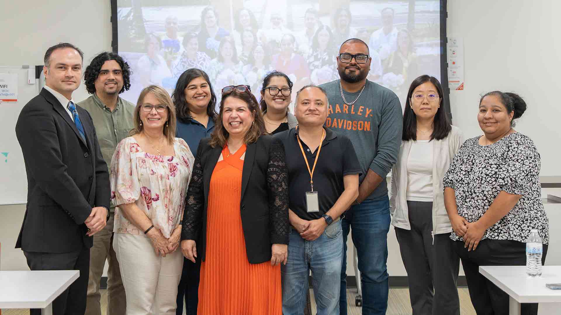 Research team gathers for a group photo after a collaborative meeting, highlighting partnership and commitment to Alzheimer's research.