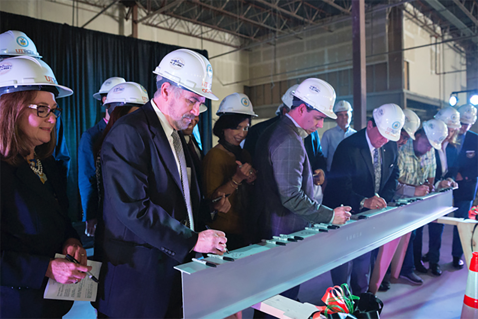 UTRGV President Guy Bailey and Weslaco-area leaders sign a beam to be used in the construction of the new Weslaco UTRGV Center for Innovation and Commercialization, or CIC, (UTRGV Photo by Paul Chouy)