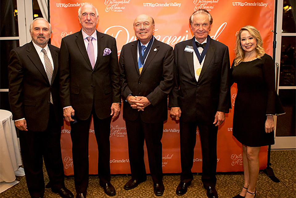 Image descriptionUTRGV honored three outstanding alumni with the 2018 Distinguished Alumni Award during a ceremony March 1 at the McAllen Country Club. The award recognizes high-achieving alumni who have made significant contributions to society through their accomplishments, affiliations, careers and philanthropy. Shown at the event are (from left) UTRGV Founding President Guy Bailey, who presented the awards; recipient Gen. William F. Garrison of Hico, Texas, a retired major general of the U.S. Army and 1966 graduate of UTRGV legacy institution Pan American College; recipient Sen. Juan “Chuy” Hinojosa of McAllen, a 1970 graduate of Pan American College who has served Texas Senate District 20 since 2002; and recipient Welcome Wilson Sr. of Houston, a real estate developer and businessman and a 1946 graduate of UTRGV legacy institution Brownsville Junior College; and UTRGV Vice President for Institutional Advancement Kelly Scrivner, who opened the event. (UTRGV Photo by Silver Salas)