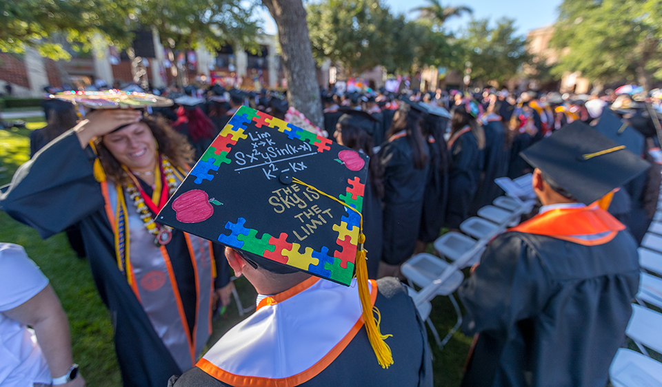 More than 700 UTRGV graduates dressed in full commencement regalia lined up for the first of four spring commencement ceremonies, held Friday evening, May 11, 2018. on the Student Union lawn on the Brownsville Campus. Close to 3,000 graduates will walk in the two-day event that started in Brownsville on Friday and ends with three ceremonies at the McAllen Convention Center on Saturday. (UTRGV Photo by David Pike)